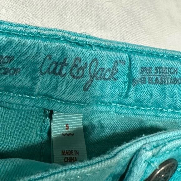 1 Jordache black with flowers jeggings and 1 pair of Cat and Jack teal jeans. - Picture 3 of 6